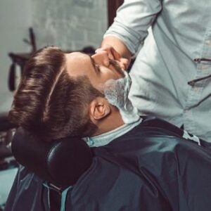 hipster-client-visiting-barber-shop-P349LDW.jpg